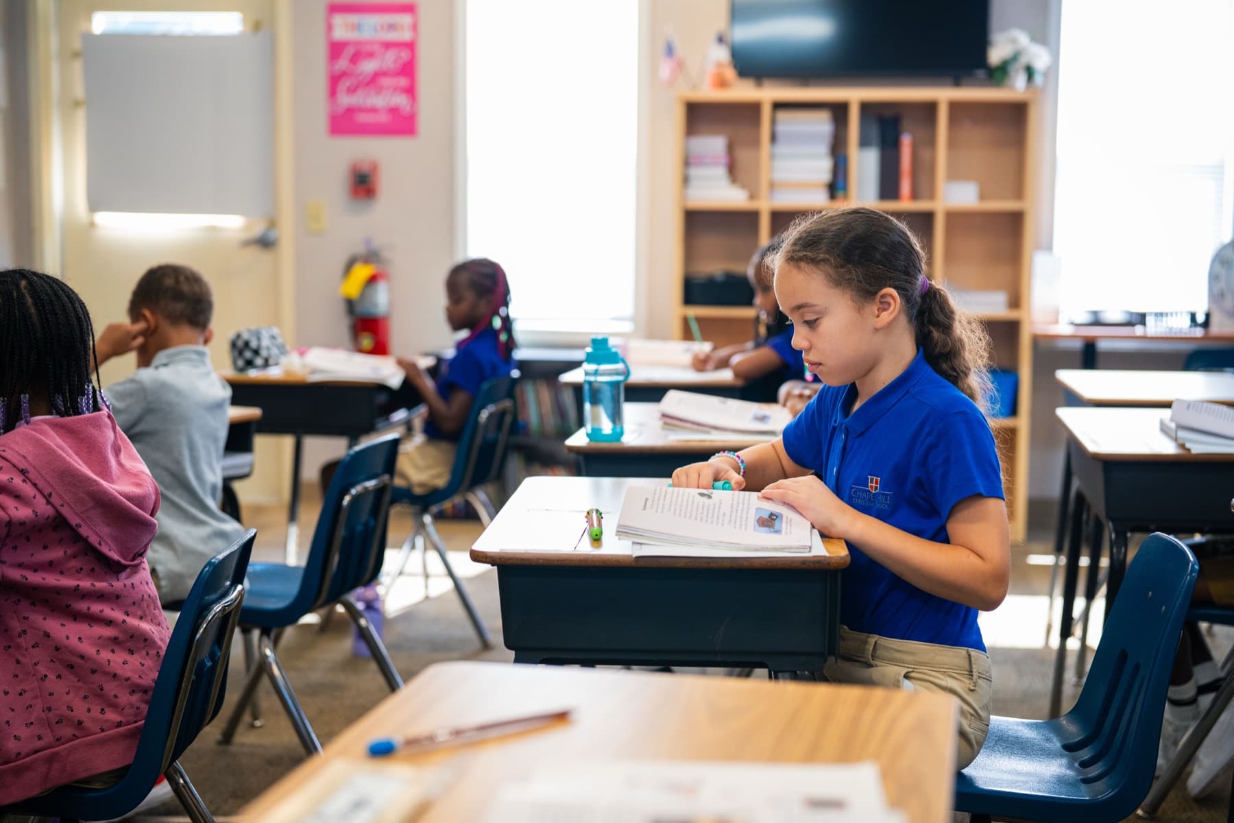 Student reading at her desk at Chapel Hill Christian School